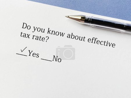 Photo for A person is answering question about taxation. He knows about effective tax rate. - Royalty Free Image