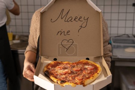 Photo for A romantic proposal of love with delicious pizza and the inscription on the box of Merry Me. High quality photo - Royalty Free Image