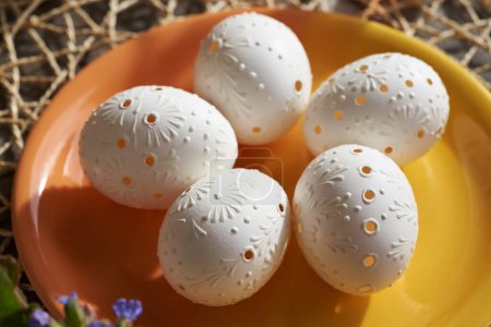 Traditional Czech Easter eggs decorated with wax in sunlight