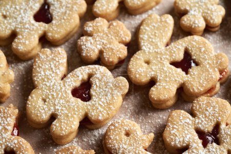 Linzer cookies in the shape of Easter bunnies and four leaf clovers, close up
