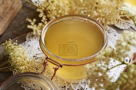 Photo for A glass jar of homemade elderberry flower syrup made in spring - Royalty Free Image