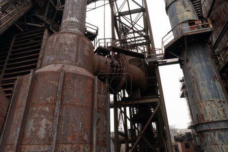 Industrial architecture with heavy metal structure, rusting decay, horizontal aspect