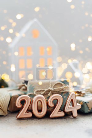 Christmas and New Year card. Number 2024 on holiday background. Christmas lights bokeh background. Holiday postcard. Happy New Year 2024 Card Concept.