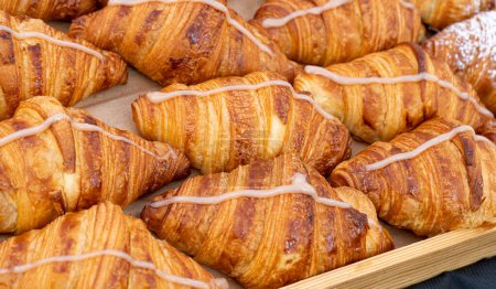 Photo for Many Croissant at Street Market, Fresh Puff Pastry Pies, Sweet Kipferls, Buttery Viennoiseries, Layered Yeast Leavened Dough Pastries, French Croissants - Royalty Free Image