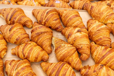 Photo for Many Croissant at Street Market, Fresh Puff Pastry Pies, Sweet Kipferls, Buttery Viennoiseries, Layered Yeast Leavened Dough Pastries, French Croissants - Royalty Free Image