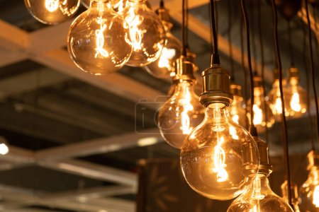 Photo for Hanging Retro Lamps, Vintage Style Industrial Lightbulbs, Warm Light Bulb in Interior, Retro Lams - Royalty Free Image