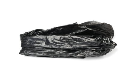 Foto de Crumpled Garbage Bag Isolated. Wrinkled Trash Package, Used Plastic Bin Bags, Black Polyethylene Waste Container on White Background - Imagen libre de derechos