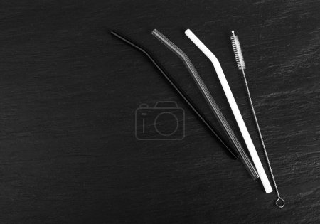 Photo for Glass Drink Straws with Cleaning Brush, Black and White Drinking Straw Set, Eco-Friendly Glass Cocktail Tubes Collection, Zero Waste Pipe on Black Background - Royalty Free Image