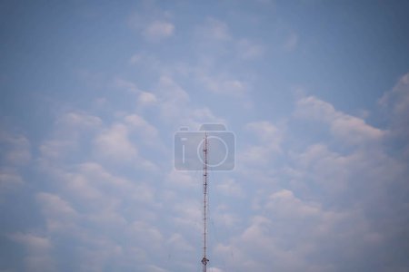 Transmission towers or cell phone towers on the morning sky background. Technology concepts in internet and mobile communication.