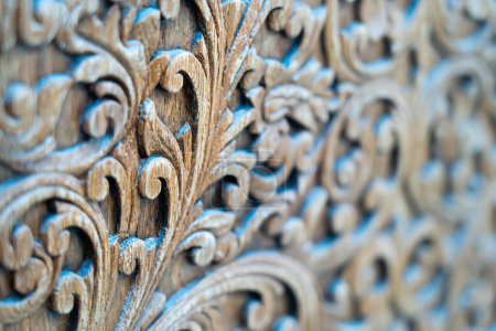 Pattern of carved pattern on wooden background.