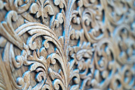 Pattern of carved pattern on wooden background.