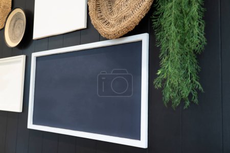 Photo for Interior design of the living room and empty frames on the wooden wall decorating the house. - Royalty Free Image