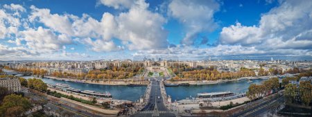 Photo for Scenery view from the Eiffel tower height to the Paris cityscape, France. Seine river, Trocadero area and La Defense metropolitan district seen on the horizon - Royalty Free Image