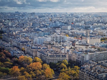 Photo for Paris cityscape view from the Eiffel tower height, France. Fall season scene with colored trees - Royalty Free Image
