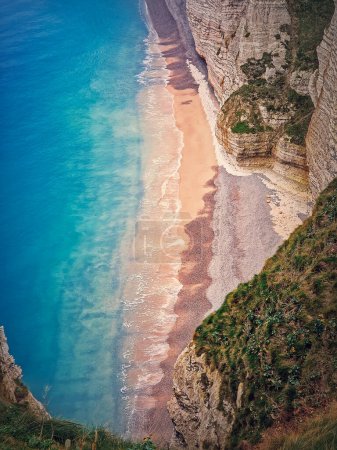 Photo for Tropical lagoon aerial view. A beach hidden behind the high cliffs and washed by the blue and clean ocean water. Summer seaside background - Royalty Free Image