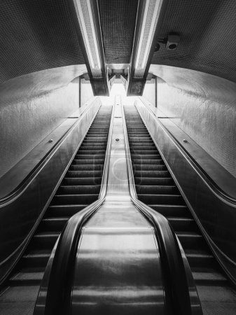 Photo for Subway escalator black and white architectural details. Symmetrical underground moving staircase - Royalty Free Image