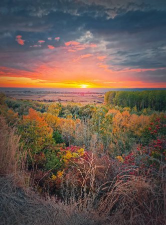 Photo for Silent autumn evening over the valley. Multicolored fall forest and orange october sunset - Royalty Free Image