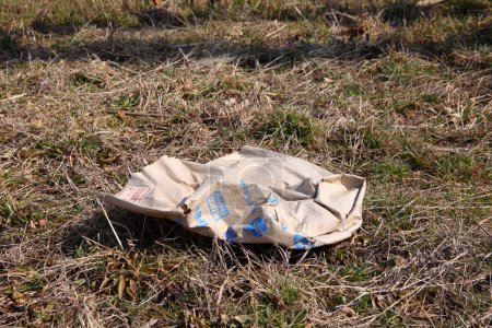 Photo for Litter (paper bag) along a roadside - Royalty Free Image