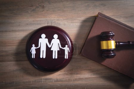 Photo for Paper cut family, judge gavel and book. Family Law - Royalty Free Image