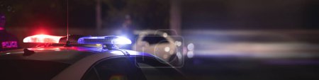 Photo for Red and blue light flasher. Police car at night time in the city - Royalty Free Image