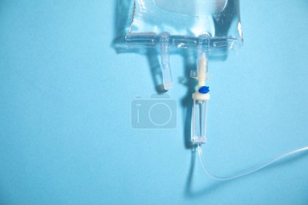 Photo for Infusion bag in the blue background. IV drip chamber - Royalty Free Image