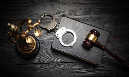 Photo for Statue of Lady Justice, handcuffs, book and gavel. - Royalty Free Image