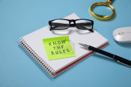 Photo for Know The Rules on sticky note on the blue background. - Royalty Free Image