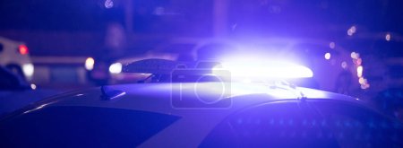 Photo for Blue light flasher. Police car at night time in the city - Royalty Free Image