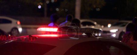 Photo for Red light flasher. Police car at night time in the city - Royalty Free Image