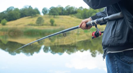 Photo for Fisherman catches fish. Fishing. Hobby - Royalty Free Image