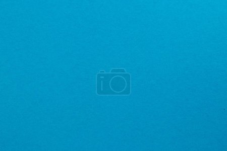 Pacific blue colored tinted paper sheet background.