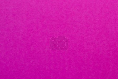 Fuchsia colored tinted paper sheet background. Purplish red color shade.