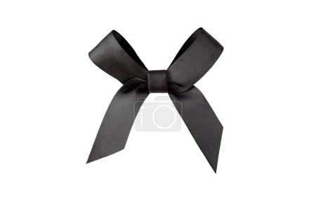 Black satin bow isolated on white. Dark elegant shiny ribbon tied knot. Mourning crepe.
