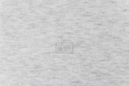 Light heather gray thick brushed cotton footer fabric texture. Soft knitwear textile background.