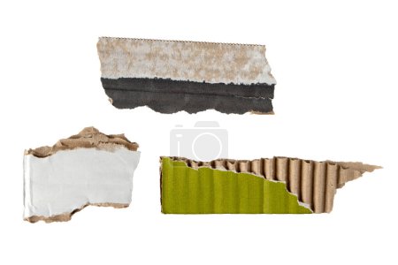 Three scraps of recycled green and black cardboard box isolated on white. Grunge packing paper design elements. Shabby fragments of shipping container