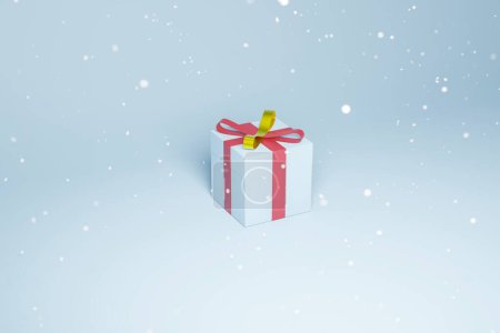 Téléchargez les photos : Rendu 3d d'un coffret cadeau bleu avec nœud papillon et rubans. Vacances d'hiver, illustration liée à Noël d'un cadeau avec espace texte, fond bleu - en image libre de droit