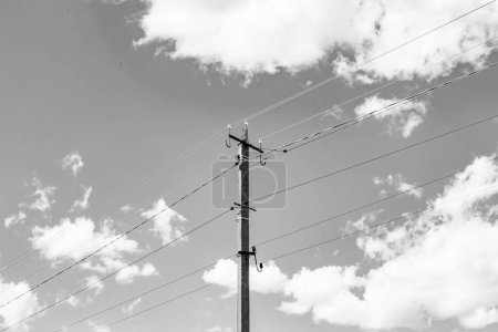 Photo for Power electric pole with line wire on light background close up, photography consisting of power electric pole with line wire under sky, line wire in power electric pole for residential buildings - Royalty Free Image