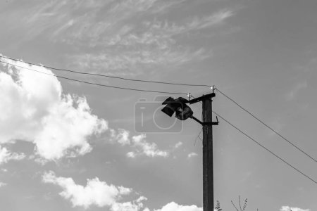 Photo for Power electric pole with line wire on light background close up, photography consisting of power electric pole with line wire under sky, line wire in power electric pole for residential buildings - Royalty Free Image