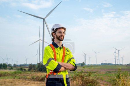 Photo for Engineer inspection and survey work in wind turbine farms rotation to generate electricity energy. - Royalty Free Image