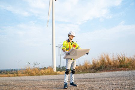 Photo for Engineer with technician are inspection work in wind turbine farms rotation to generate electricity energy. - Royalty Free Image