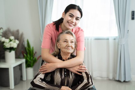 Photo for Female caregiver holding hands lady patient of nursing home,Expressing empathy and understanding. - Royalty Free Image