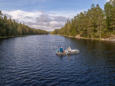 Photo for Aerial footage couple Kayaking Boat tour on lake Ragnerudssjoen in Dalsland Sweden beautiful nature forest pinetrees. - Royalty Free Image