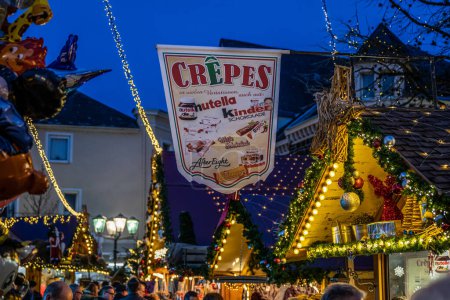Photo for Koblenz Germany 17.12.2022 imbiss selling food meat and sausages Traditional Christmas market booth sign crepes. - Royalty Free Image