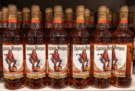 Photo for Andernach Germany 04.01.2020 liquor store, bottles with Captain Morgan Spiced Gold straight whiskey with sign. - Royalty Free Image