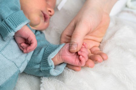 Photo for Sweet tiny new born baby hand hold mum index finger. concept relationship between mother or parants and baby. - Royalty Free Image