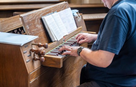 Photo for Hand playing on church organ at Event dinner Close-up Small depth of field. - Royalty Free Image