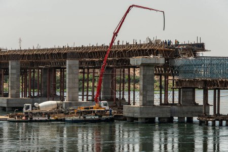 Photo for Build of new Nile river Bridge after Luxor in direction Assuan during boat cruise construction site. - Royalty Free Image
