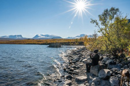 Photo for Autumn season in Abisko with Lake Tornetraesk in background, taken from Bjoerkliden, Swedish Lapland, Sweden. - Royalty Free Image