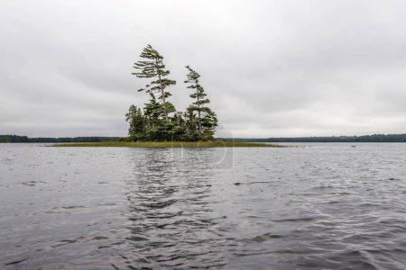 Photo for River and islands in morning mist at Kejimkujik National Park Designated Canoe ride Wilderness Nova Scotia Canada. - Royalty Free Image