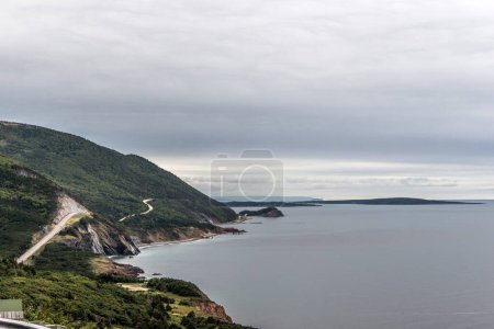 Photo for A panoramic view of the Cape Breton Island Coast line cliff scenic Cabot Trail route, Nova Scotia Hghlands Canada. - Royalty Free Image